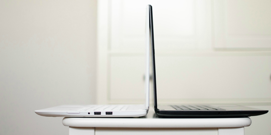 Black and white laptops back-to-back