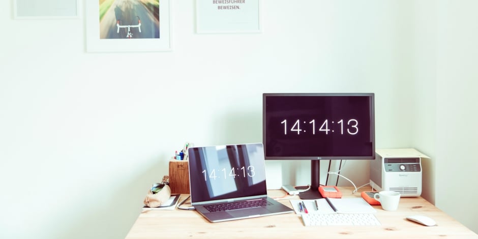 Social media workspace keeping time with two clocks on the screen