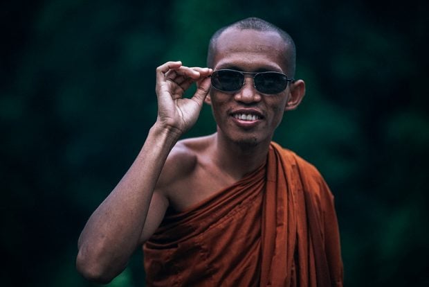 Monk wearing sunglasses